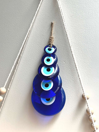 Evil Eye Hanging for Growth & Expansion - This Evil Eye is specially curated in an ascending order to giving a visual depiction to growth & expansion, this Evil Eye wall hanging brings good luck and by carrying an evil eye charm or casting out an evil eye symbol, its said to magically bestow good luck, health and happiness to its beholder