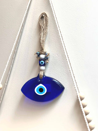 Evil Eye Hanging for Family Protection - This Turkish Golden Evil Eye wall hanging brings good luck and  by carrying an evil eye charm or casting out an evil eye symbol, its said to magically bestow good luck, health and happiness to its beholder