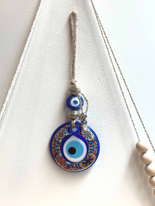 Turkish Evil Eye - his evil eye wall hanging brings good luck and  by carrying an evil eye charm or casting out an evil eye symbol, its said to magically bestow good luck, health and happiness to its beholder.