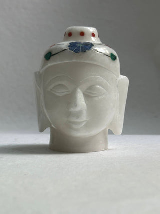 White Marble Buddha head - There is nothing more soothing for your living space than having a Buddha statue as home decor. This particular White marble  example depicts the head of Buddha in his meditative state and has been made using fine marble.