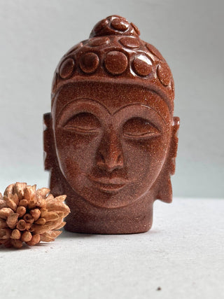 Sparkle of the Universe- Red Gold Stone Buddha face -  Encourages a positive attitude, it is an uplifting stone, Goldstone is said to promote vitality, and help to lift anxious people to a happier mindset