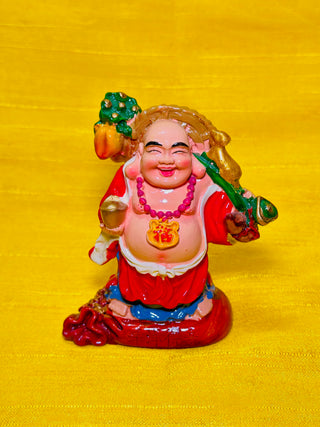 Laughing Buddha for Wealth & Power - A beautiful Laughing Buddha carrying a Gold Ingot and Ru Yi stick on each side is a symbol of Feng Shui of wealth and power.